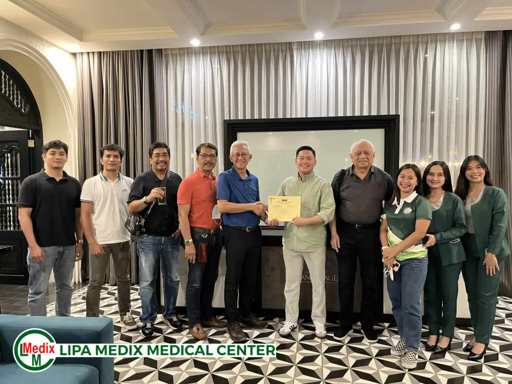 Lipa Medix Medical Center stakeholders receiving certificate
