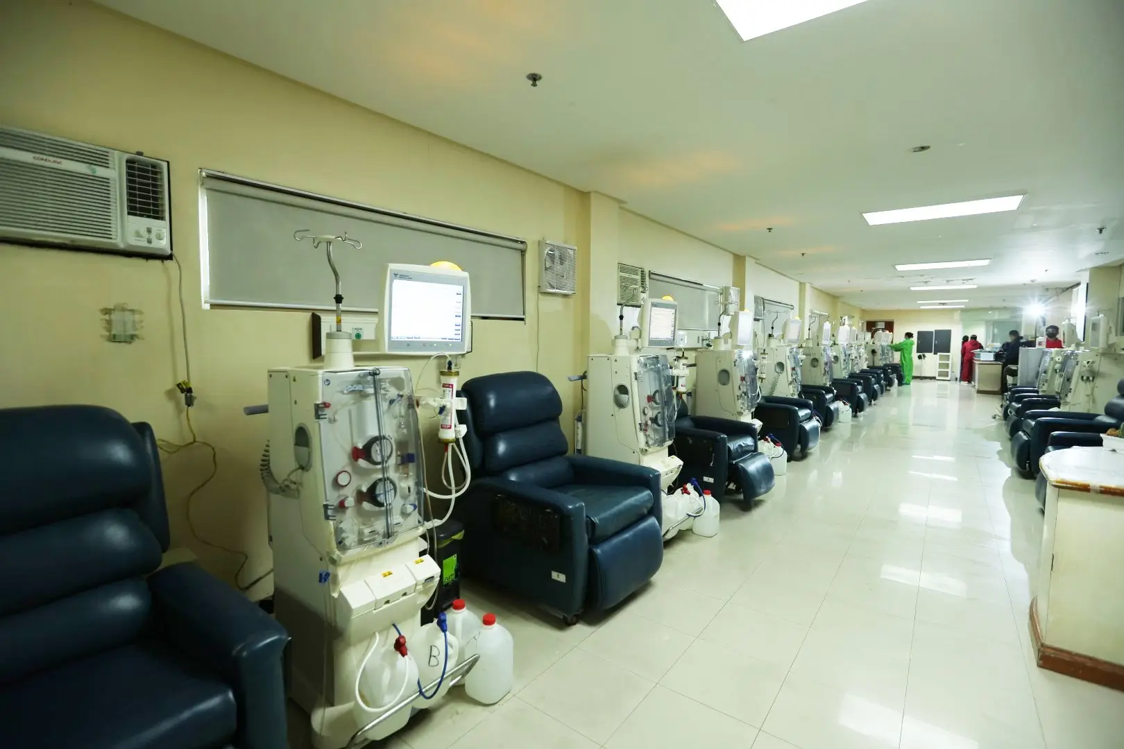 Dialysis machines with patient chairs in clinic.